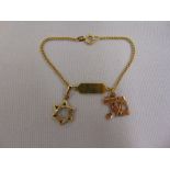 14ct gold bracelet with two 14ct gold pendants, approx total weight 5.2g