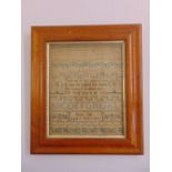 A George III framed and glazed sampler by Sarah Hill aged 9 years old dated 1818