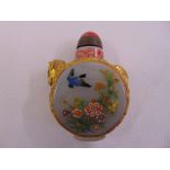 A Chinese Peking glass snuff bottle decorated with birds and flowers