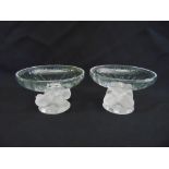 A pair of Lalique Nogent design, clear slightly fluted glass bowls, atop a pedestal base formed as