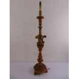 An Italian mid 20th century carved and gilded lamp stand on raised conical base, 139cm (h)