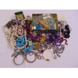 A quantity of costume jewellery to include necklaces, rings, bracelets, earrings and beads