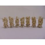Seven early 20th century Japanese ivory figurines mounted on white metal circular bases