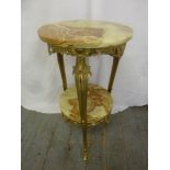 An onyx and gilded metal circular side table on three scroll supports