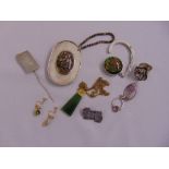 A quantity of costume and silver jewellery to include a brooch, earrings and a pendant