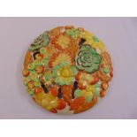 Clarice Cliff My Garden circular wall plaque, pierced and moulded with flower heads, mark to