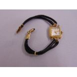 Eska 18ct yellow gold ladies wristwatch on a leather and gilt metal strap