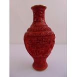 Chinese cinnabar lacquer baluster vase profusely carved on raised circular foot