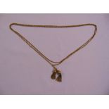 A Victorian gold muff chain with two tassels, tested 15ct, approx total weight 43.0g