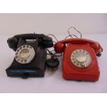A mid 20th century black plastic telephone A/F and red plastic telephone