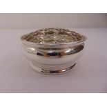 A silver circular posy bowl, bellied on rim foot with mesh cover