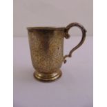 A Victorian silver Christening mug, cylindrical with leaf capped double scroll handle, the sides