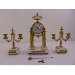 Leroy gilded metal and white marble clock set, white enamel dial, Arabic numerals, two train