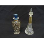 A cut glass scent bottle of conical form with silver collar and drop stopper and an overlaid glass