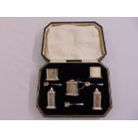 A cased silver condiment set comprising a mustard pot, a pair of pepperettes, a pair of salts and