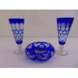 A pair of continental blue overlaid glass vases and a matching fruit bowl