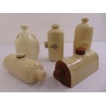 Five late 19th century ceramic foot warmers of varying shape and form