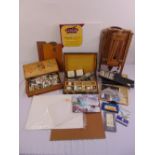 A quantity of artist materials to include oil paints, crayons, folding easel brushes, a canvas and