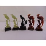 Five oriental carved hardstone figurines of birds mounted on hardwood plinths, A/F