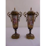 A pair of French style tapering cylindrical porcelain garnitures with gilded metal mounts the