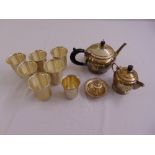 A quantity of white metal to include a teapot, hot water jug, beakers and a pill box