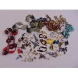 A quantity of costume jewellery to include necklaces and earrings