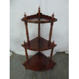 A three tier painted corner whatnot with turned finials