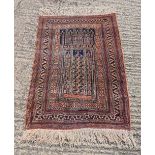 Persian style wool brown and black ground carpet with repeating geometric design and border, 129 x