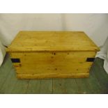 A Victorian rectangular pine blanket box with hinged cover and metal brackets
