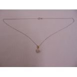 A 9ct gold and diamond pendant on an 18ct gold chain