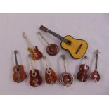A quantity of miniature guitars and mandolins (9)