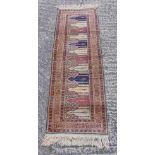 Persian style wool runner with repeating geometric design and border, 176 x 58cm