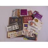 A quantity of GB coins and first day covers to include proof sets and framed coinage
