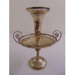 A Victorian silver circular table centre piece scroll pierced borders, scrolling side handles on