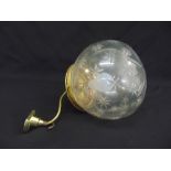 A glass globular hall light etched with stars and with gilded metal mounts