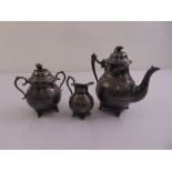 A three piece teaset to include teapot, sugar bowl and milk jug