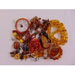 A quantity of costume jewellery to include amber and coral