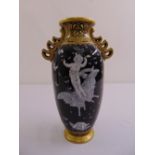 A pâte-sur-pâte ovoid vase decorated with cherubs and butterflies, bears mark to the base