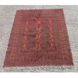 Kayen wool carpet red ground with repeating geometric pattern and border, 184 x 159cm