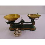A set of Victorian painted iron scales with detachable brass bowls and accompanying weights