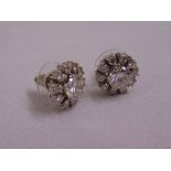 A pair of 18ct white gold and diamond cluster earrings, each central stone 1.3ct surrounded by ten