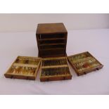 A rectangular oak four drawer specimen chest to include three drawers of microscope slides