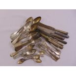 A quantity of white metal flatware to include spoons, forks and knives