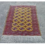 Persian style wool carpet brown and red ground with repeating geometric design and border, 159 x