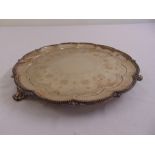 A Victorian silver salver, circular, bead and shell border, engraved to the centre with scrolls