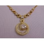 A 14ct yellow gold and diamond pendant necklace set with graduated brilliant cut and marquise