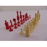 A 19th century carved and stained bone chess set