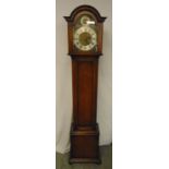 An oak long case striking clock with three chimes, silver dial with Roman numerals, to include
