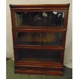 Globe Wernicke rectangular three section glazed bookcase on single drawer base and top plinth