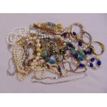 A quantity of costume jewellery to include necklaces, earrings, watches and bracelets